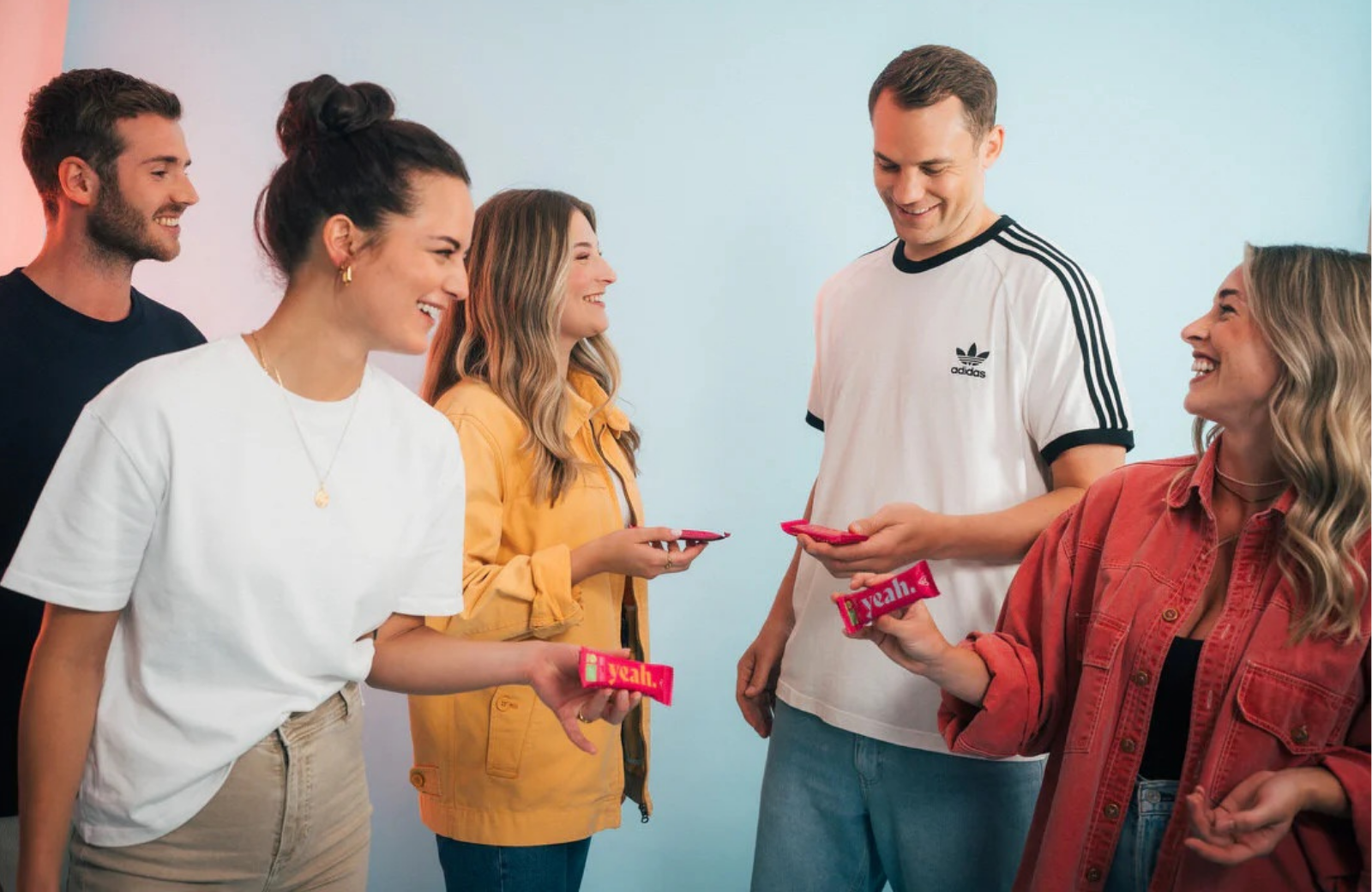 People holding Health Yeah bars during a tasting