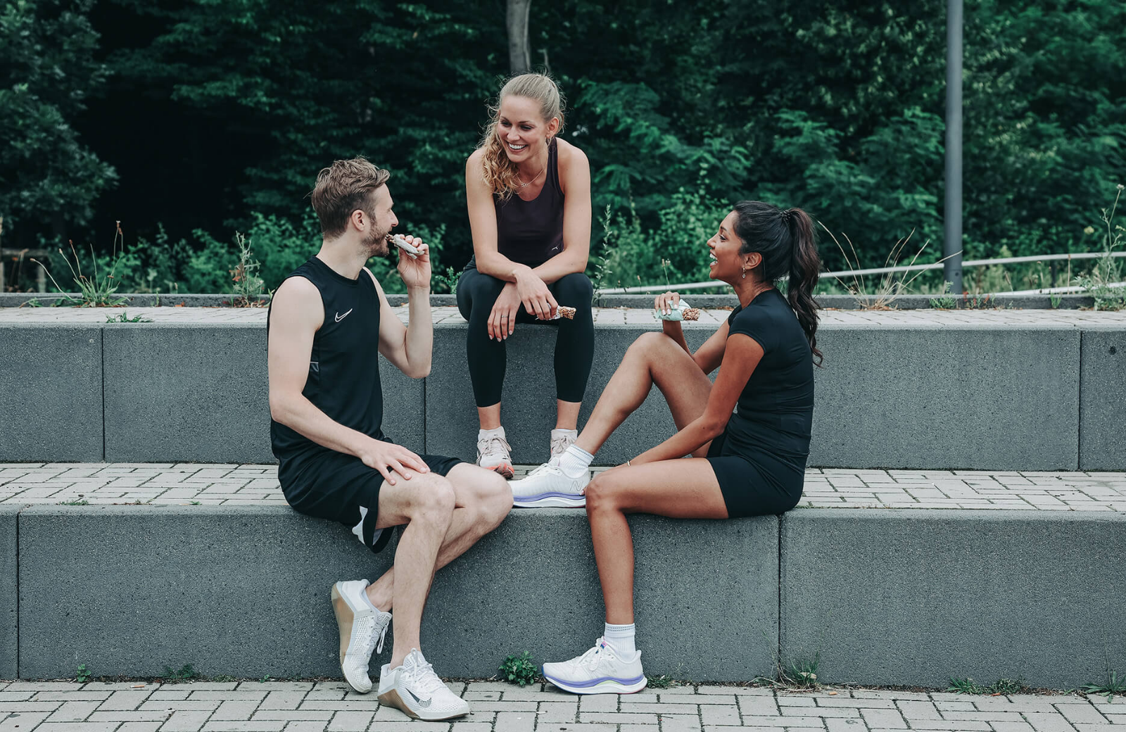 Christina Honsel with two other athletes after training with Health Yeah bars